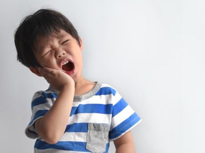Little,Asian,Boy,Suffering,From,Toothache,-,Dental,Problem.